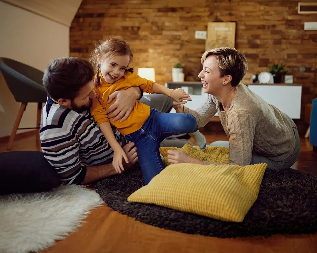 happy-small-girl-having-fun-with-her-parents-home 4